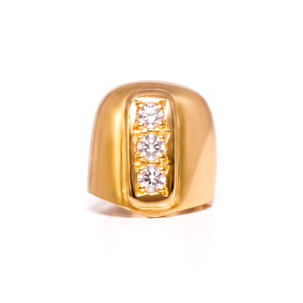 Picture of Gold Tooth with three Zirconia stones.